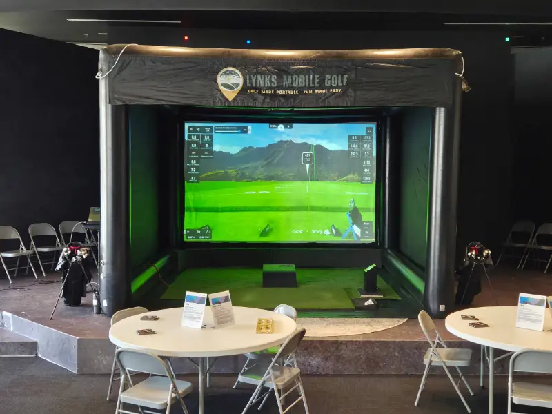 Golf simulator setup in a conference room