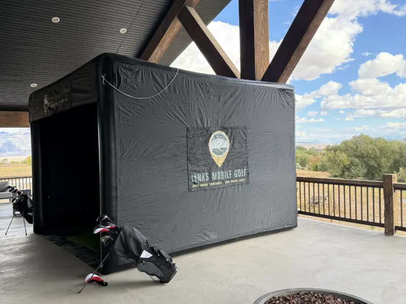 Golf simulator setup on a patio of an event venue