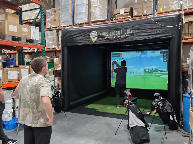Golf simulator inside of a warehouse